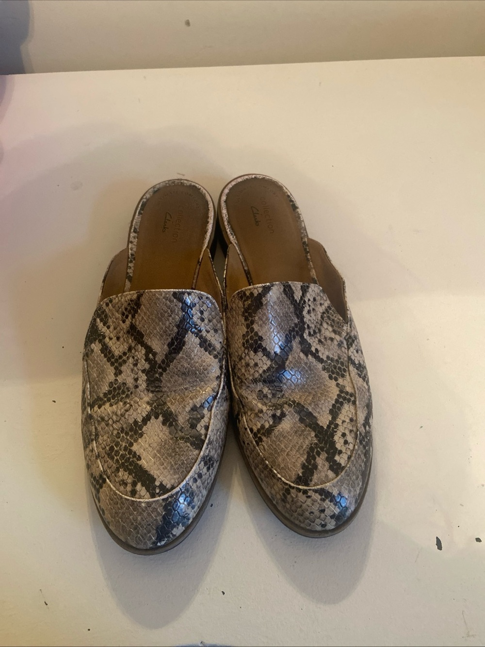 Clarks Snake-Print Slip-On Mules in Beige and Black